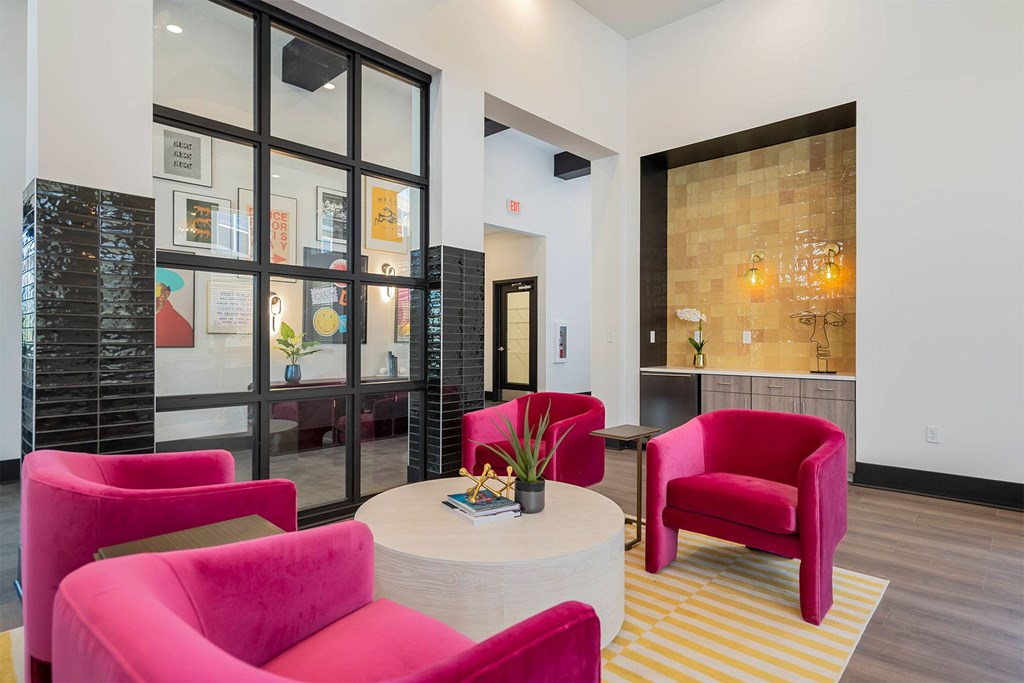 A room with a table and chairs.