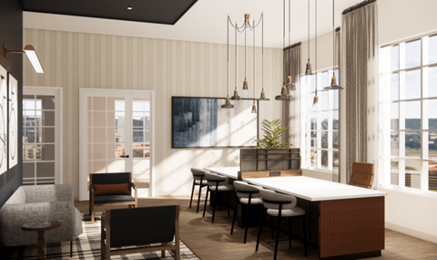 A modern dining room with a long table and chairs.