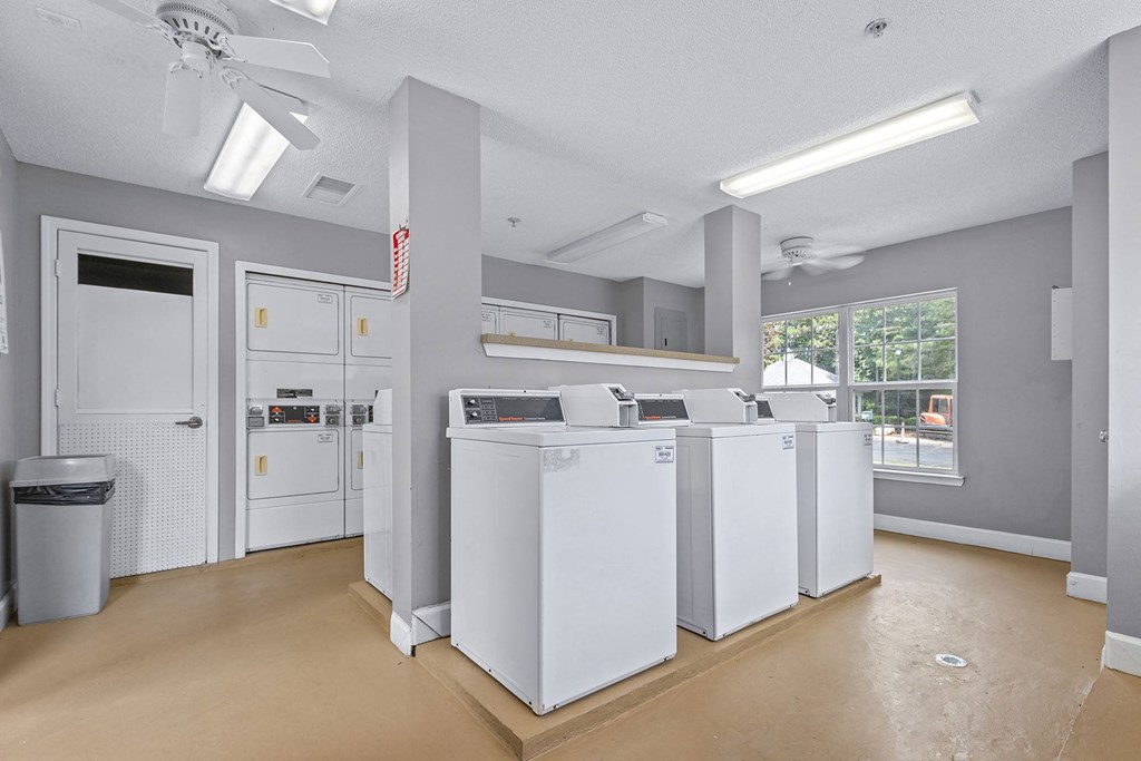 A laundry room with a washer and dryer in it.