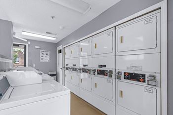 A row of washing machines in a laundromat.