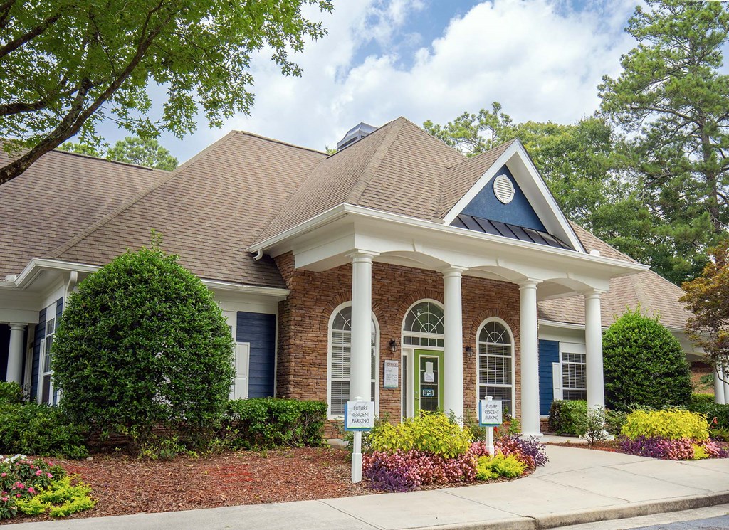 A house with a blue door and white columns.