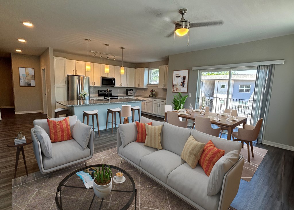 A modern living room with grey couches and a bar area.