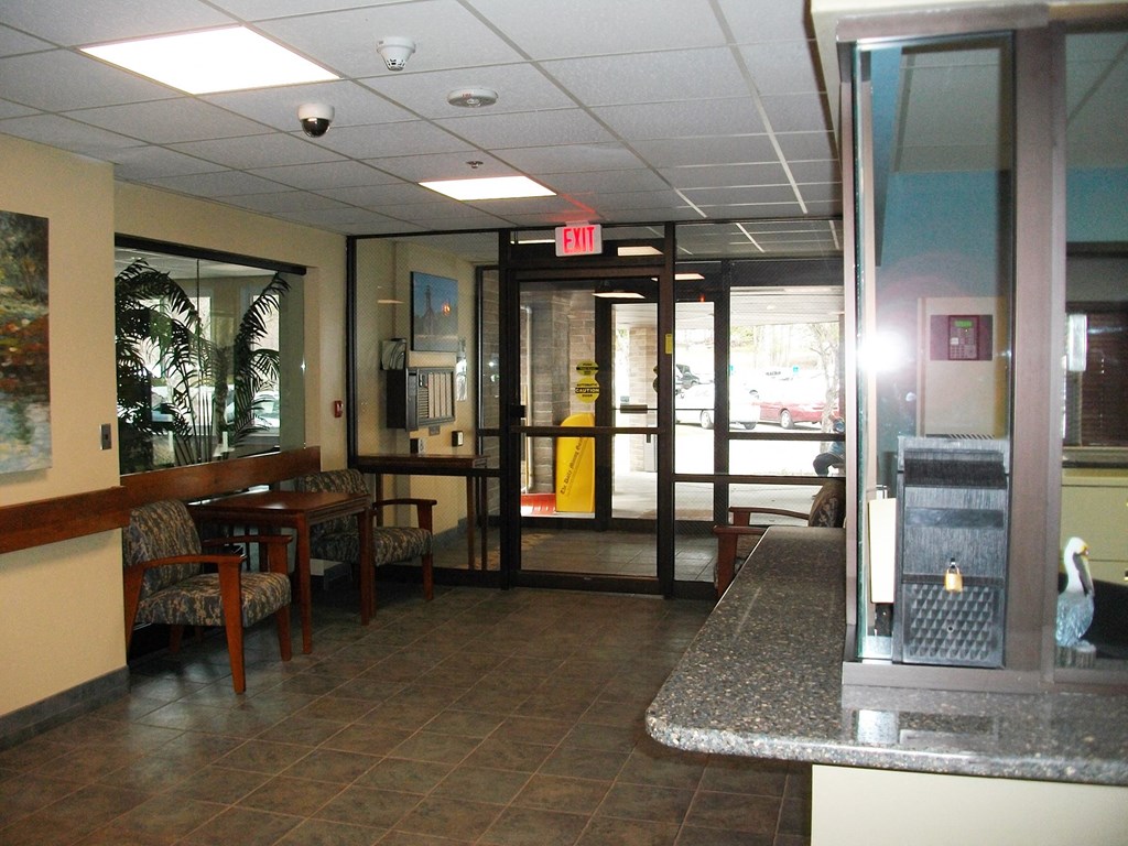 the lobby of a restaurant with tables and chairs