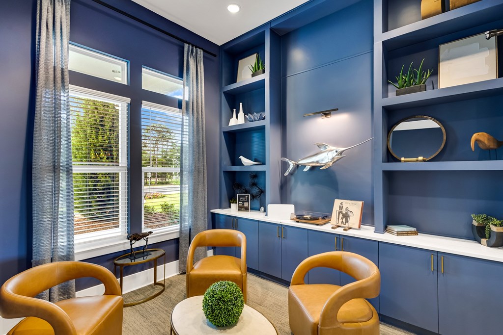 A room with blue walls and furniture.
