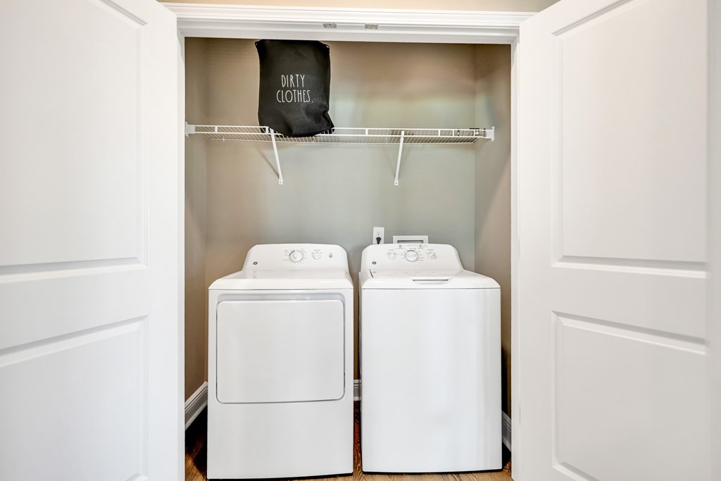 A laundry room with a washer and dryer.
