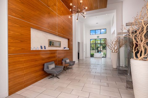 A hallway with a wooden wall and a white vase.