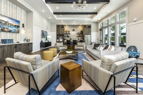 A modern living room with a large sofa set and a wooden coffee table.