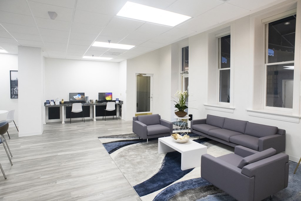 the waiting room of a physicians office with couches and a coffee table