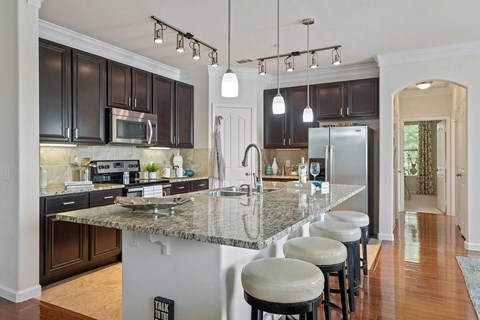 a kitchen with a marble counter top
