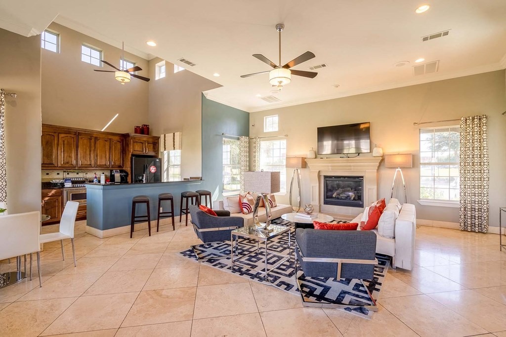 the living room is open to the kitchen and dining area  at Orion Prosper, Prosper, TX