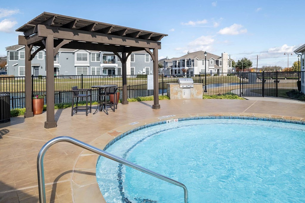 a resort style pool with a gazebo and a table and chairs next  at Orion Prosper, Prosper, TX