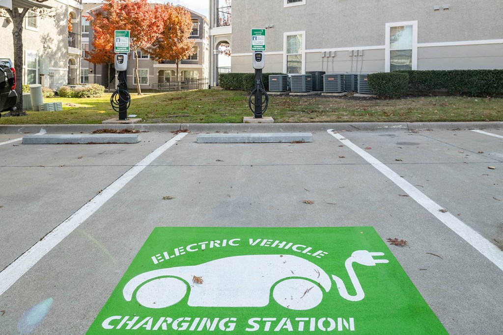 an electric vehicle charging station in a parking lot  at Orion Prosper, Texas, 75078