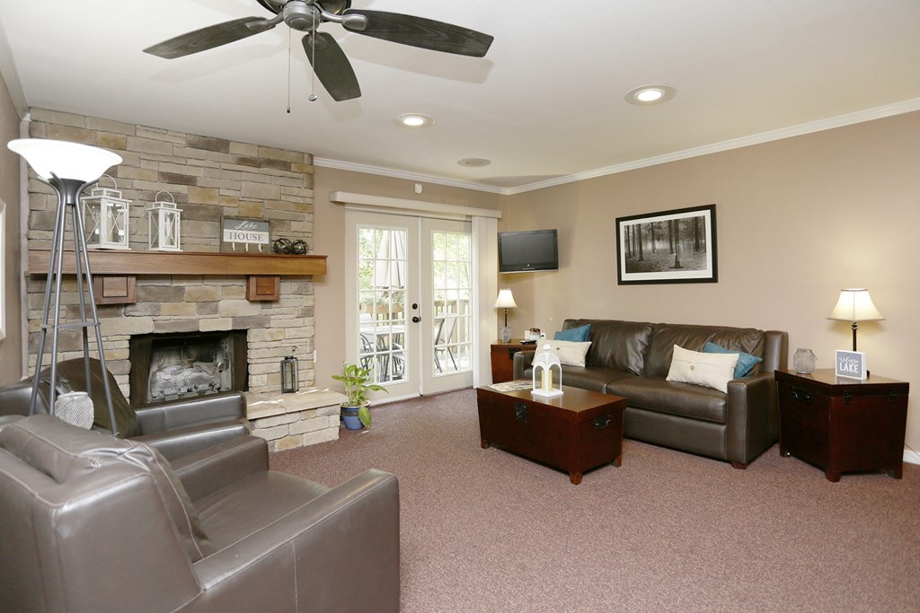 a living room with couches and a fireplace at Winchell Way Apartment , Kalamazoo, 49008