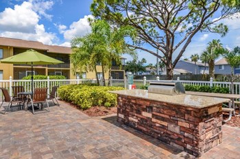 Outdoor grill with pool at Bay Club, Bradenton, Florida - Photo Gallery 4