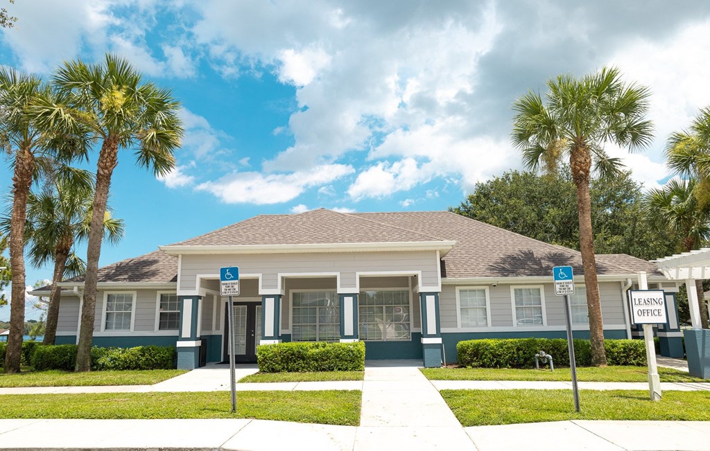 a house with palm trees in front of it