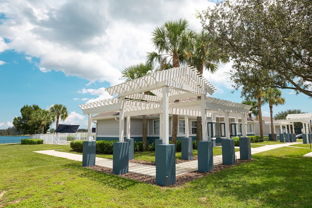 a large white pavilion with columns in front of it