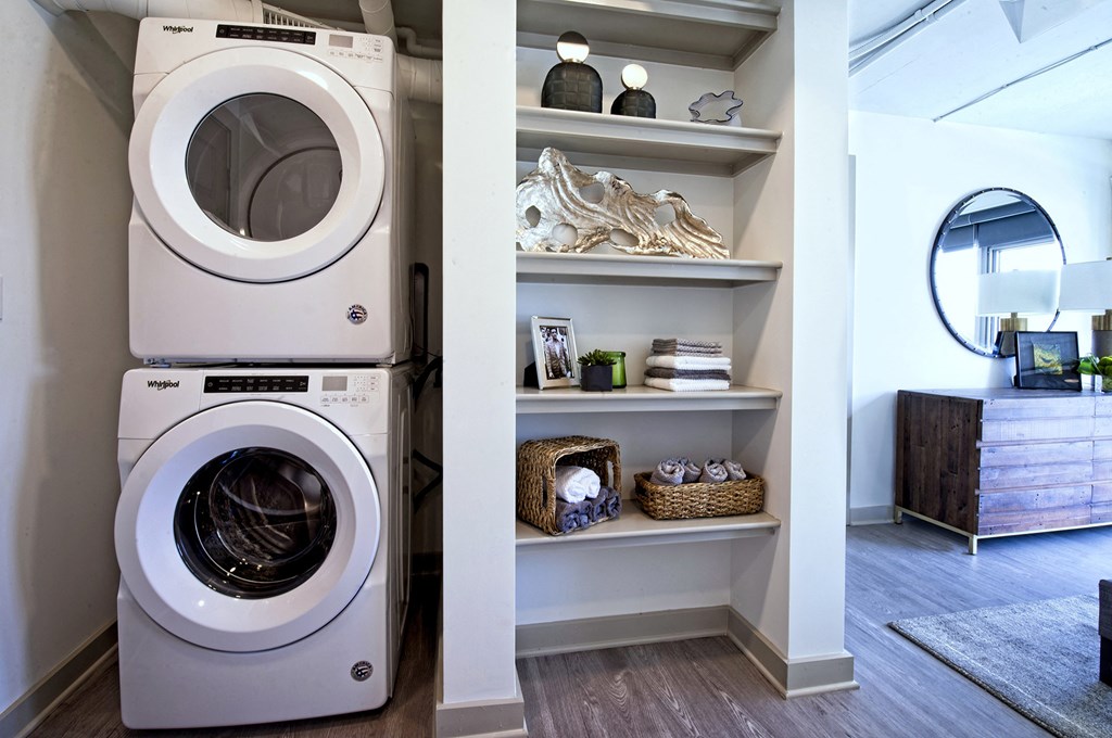a washing machine and a dryer in a laundry room