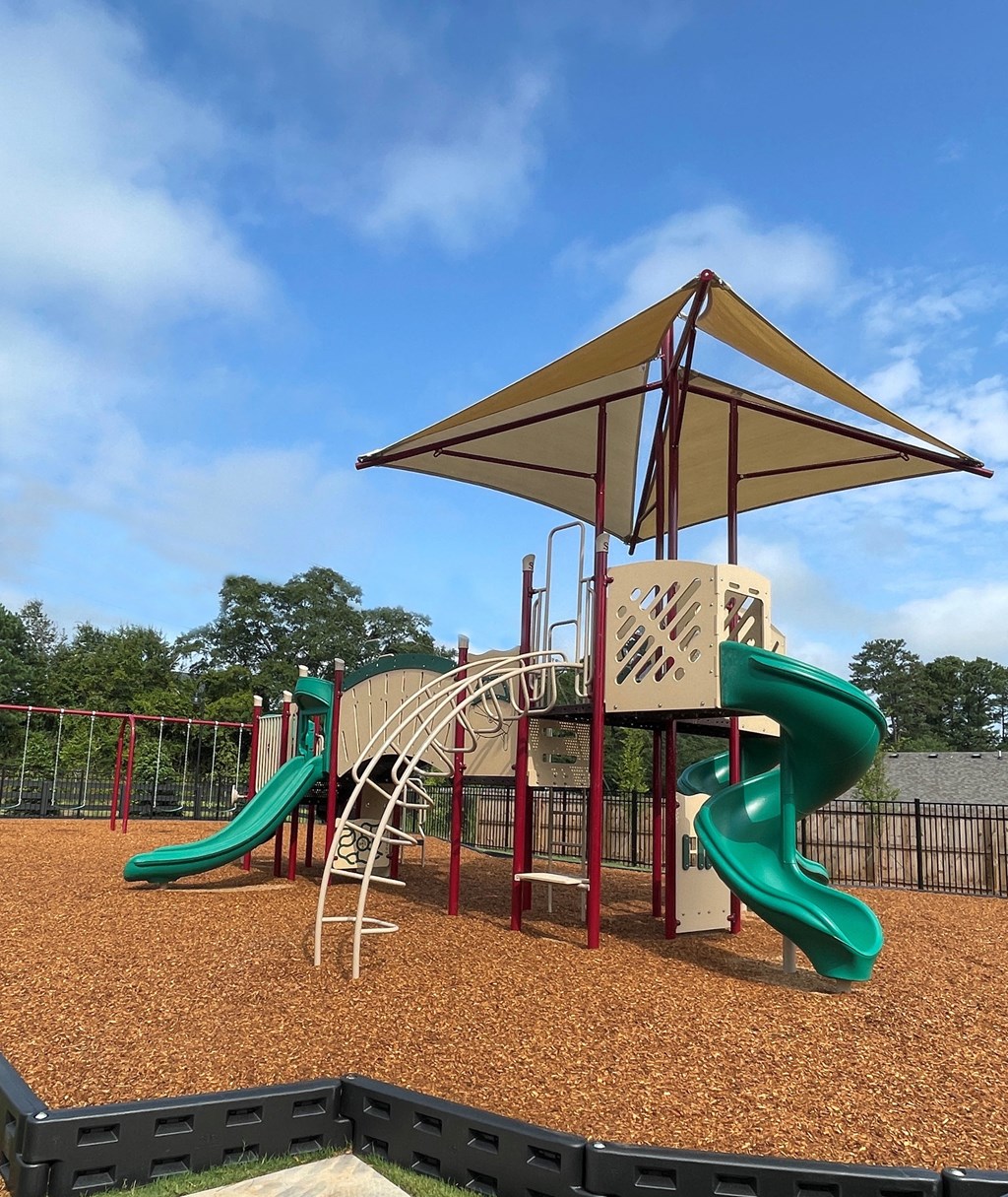 a playground with a slide and monkey bars
