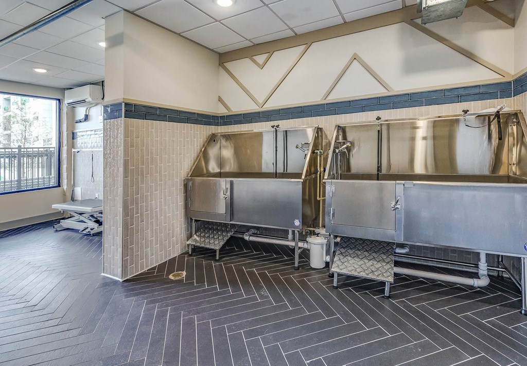 a commercial kitchen with stainless steel appliances and a large window