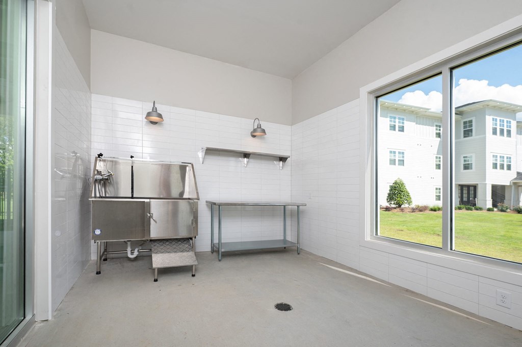 a kitchen with a stainless steel sink and a large window