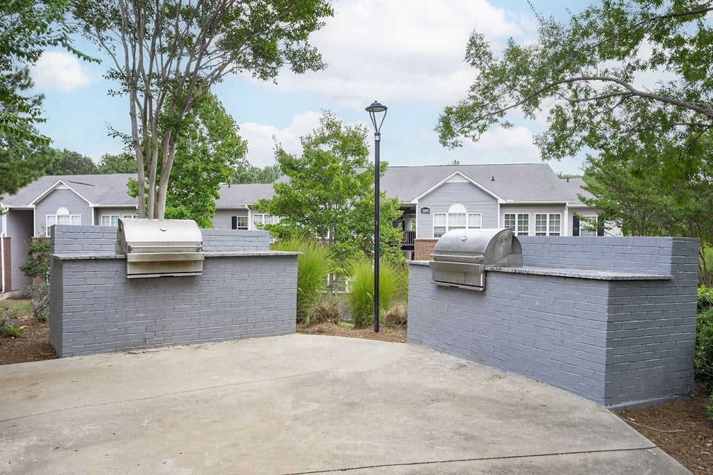 A row of houses with a street light in front.