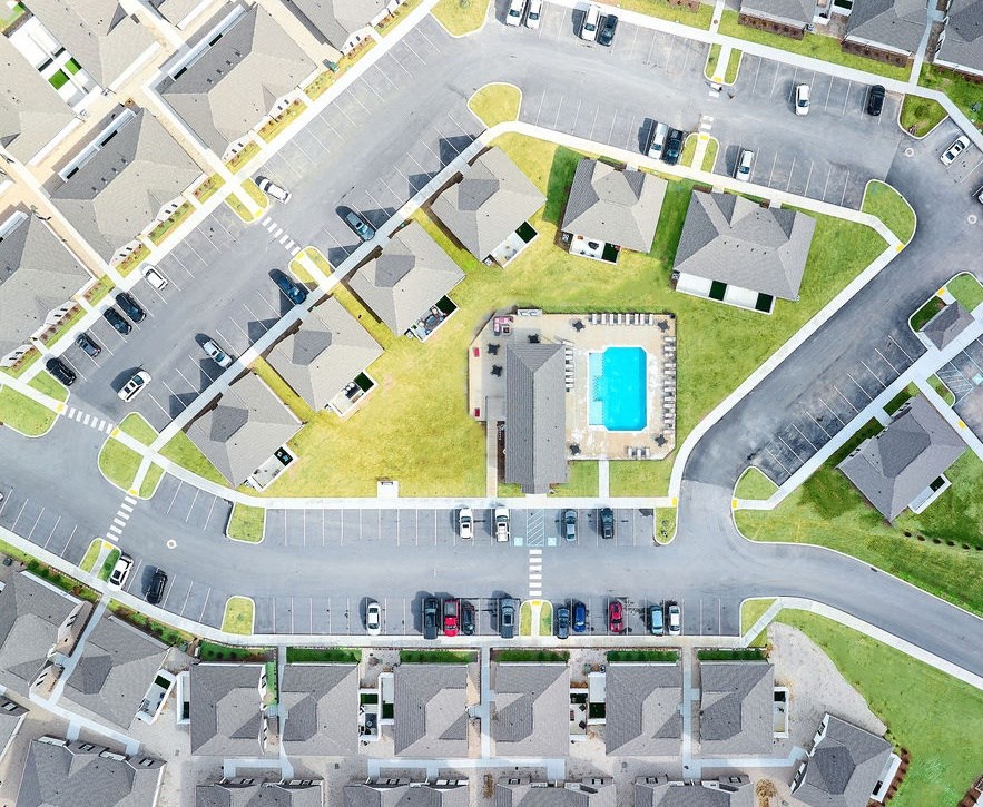a street with a swimming pool in the middle