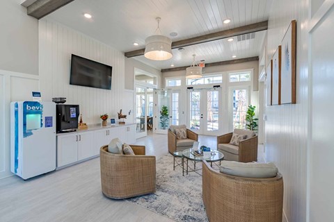 A living room with a television and a sofa.