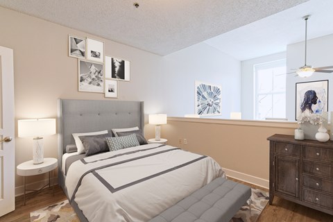 A bedroom with a large bed and a dresser.