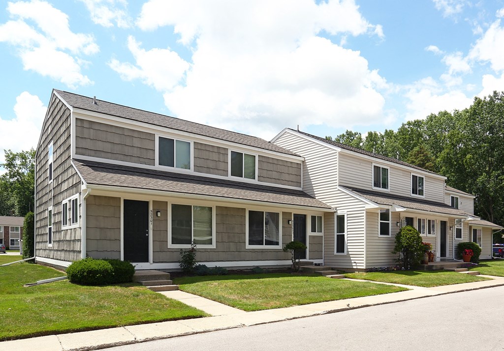 a house with a gray siding and a black door  at Pheasant Run, Saginaw, 48638