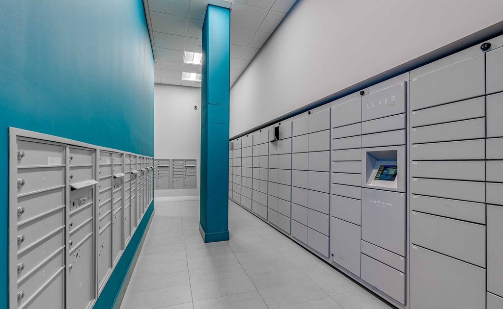 A row of lockers with a blue column in the middle.