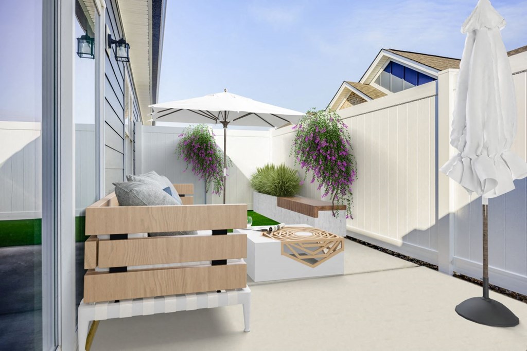 a patio with a bench and an umbrella