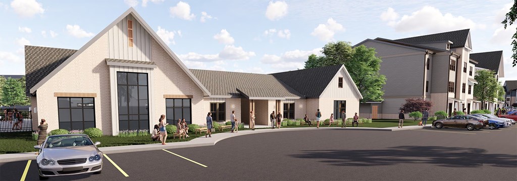 A modern building with a parking lot in front.