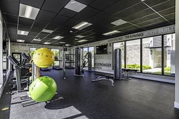 A gym with a green ball in the foreground.