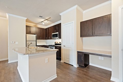 a kitchen with a counter top and a sink