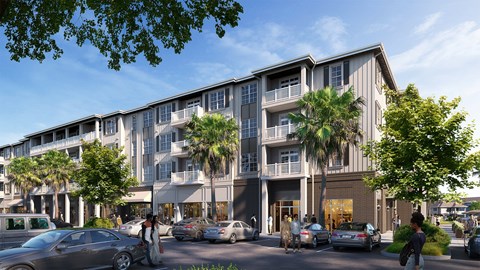 A modern apartment building with cars parked in front and people walking on the sidewalk.