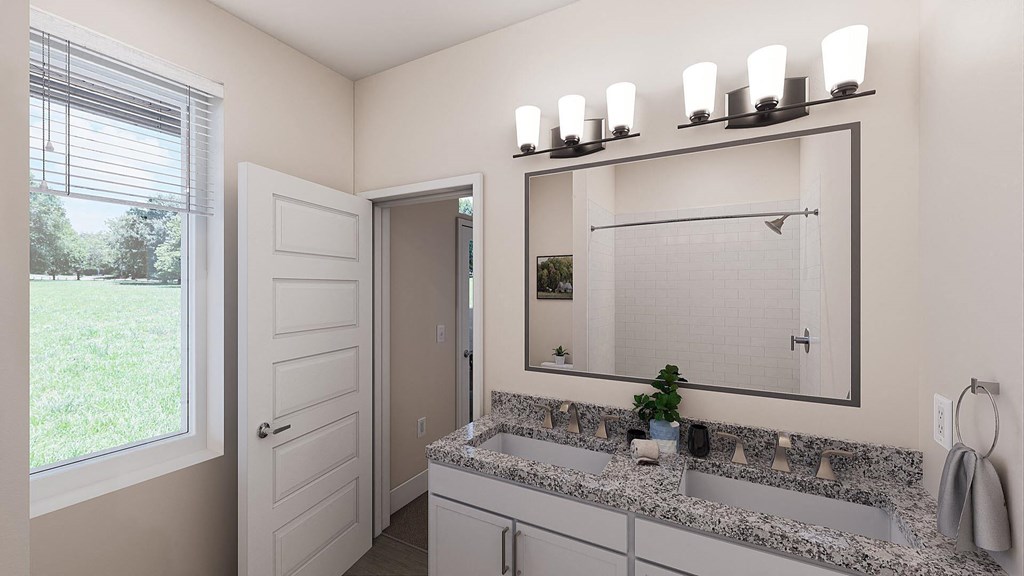 a bathroom with a large mirror and a sink