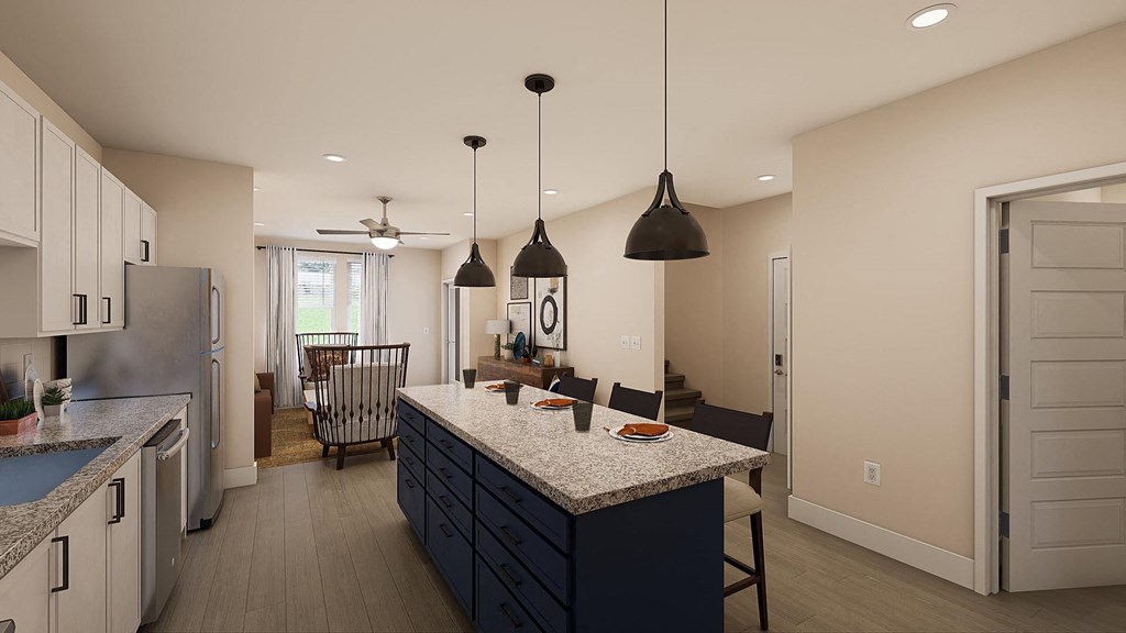 a kitchen with an island and a dining room