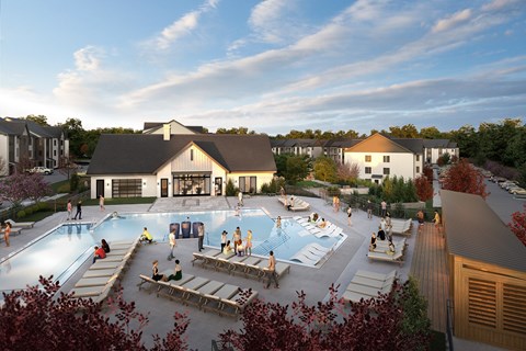 A group of people are gathered around a pool in a resort.