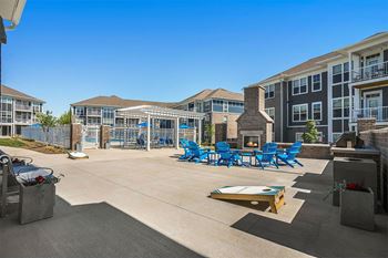 A sunny day at the outdoor pool area of a residential complex.