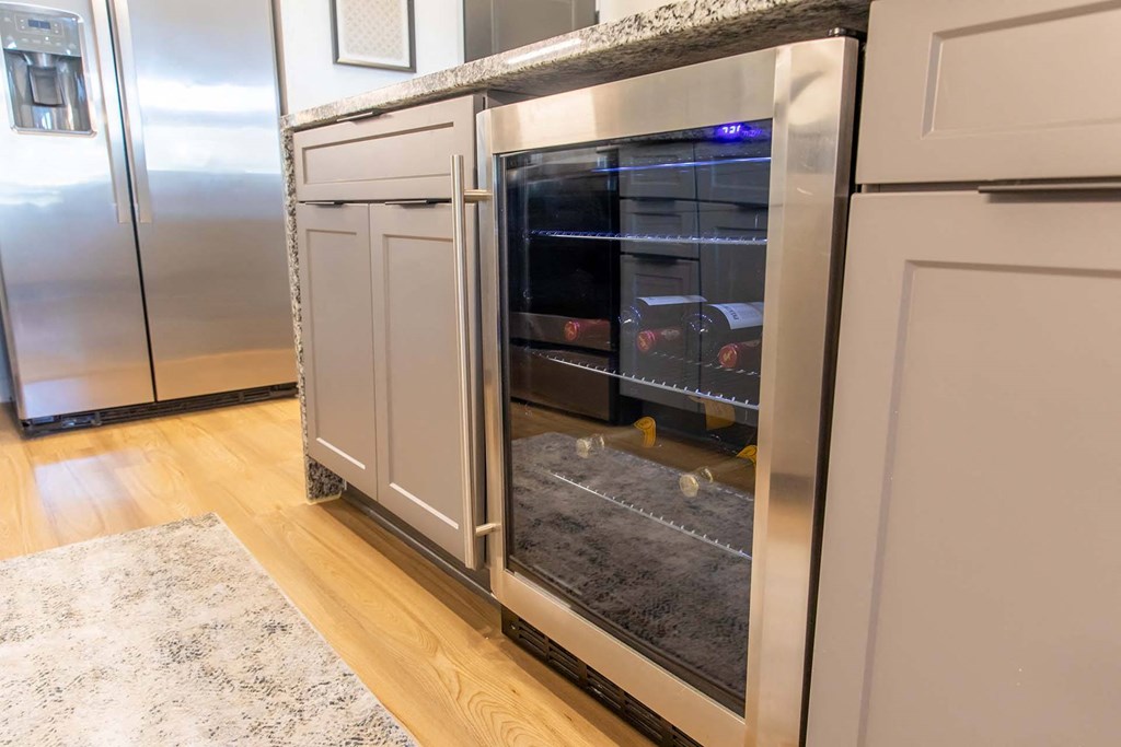 a kitchen with a wine fridge