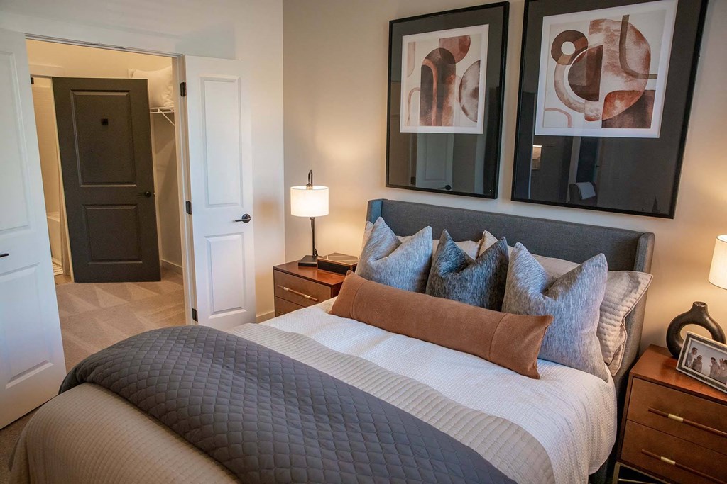 a bedroom with a bed and two night stands