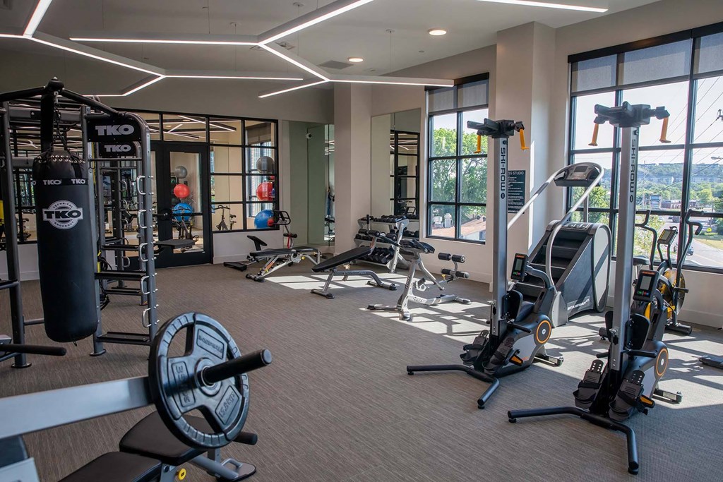 a room filled with lots of different types of exercise equipment