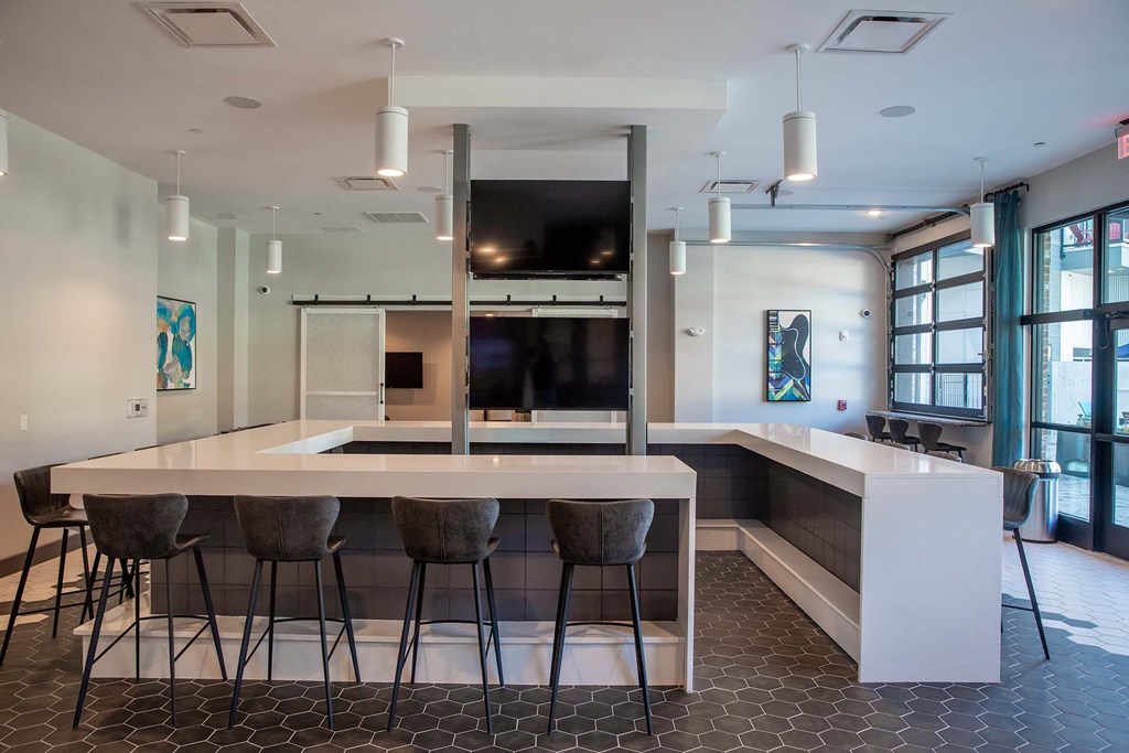 a view of the kitchen and bar in the clubhouse