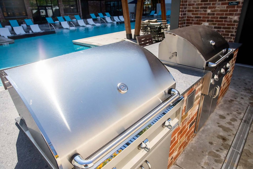 a bbq by a swimming pool