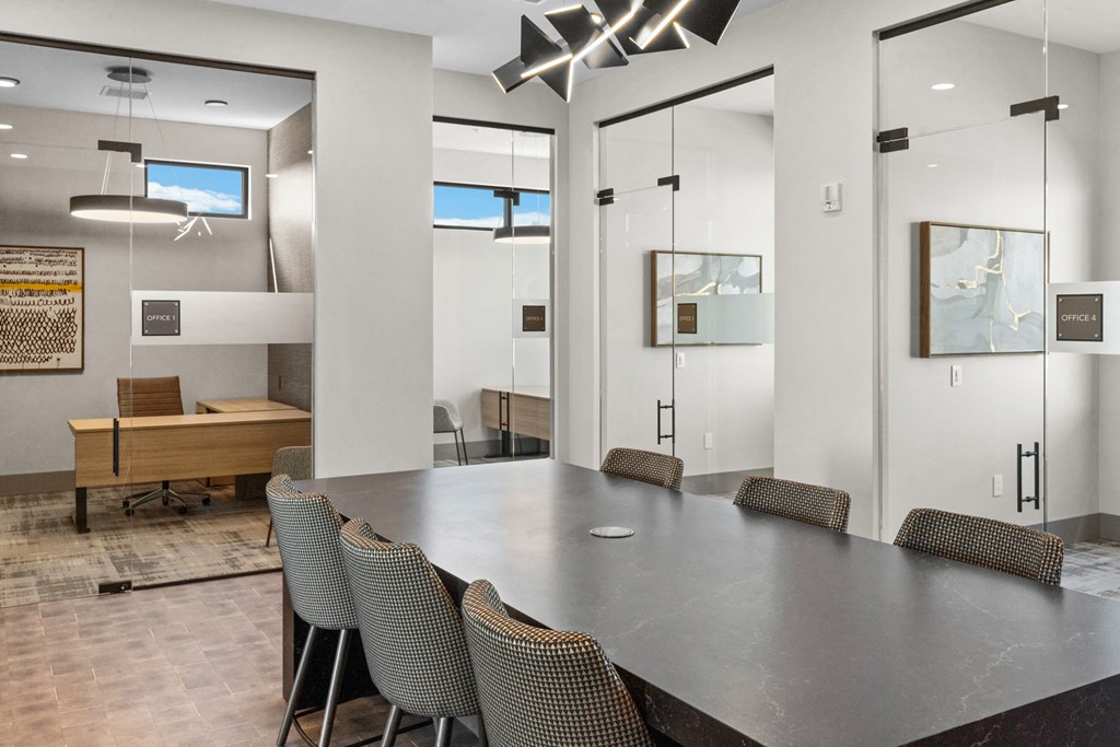 a conference room with a long table and chairs