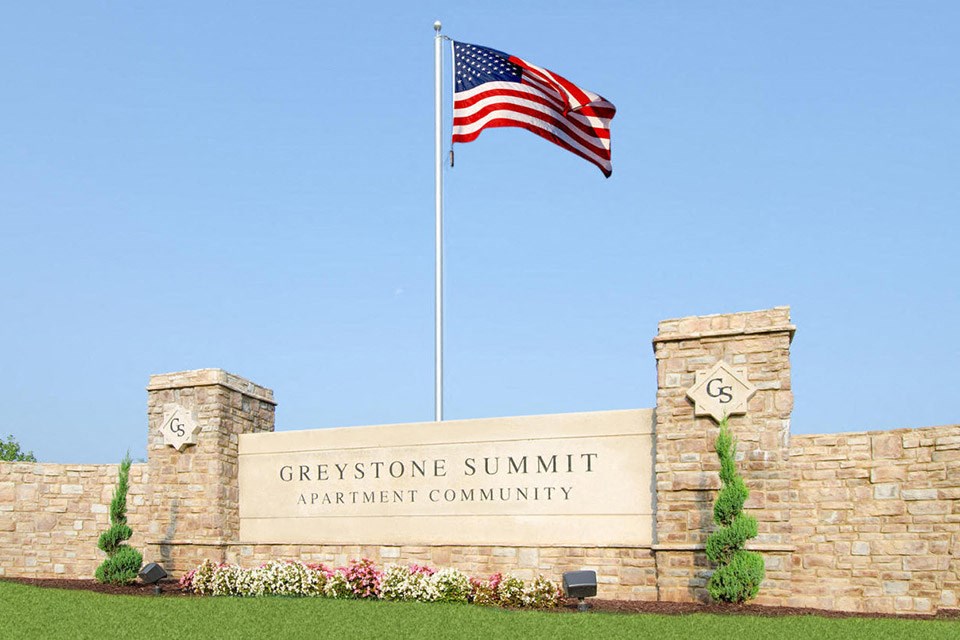 community entrance with flag
