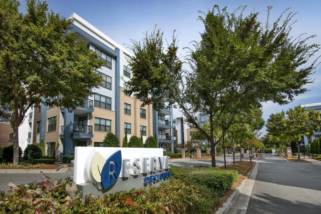 A sign for Resene is in front of a building.