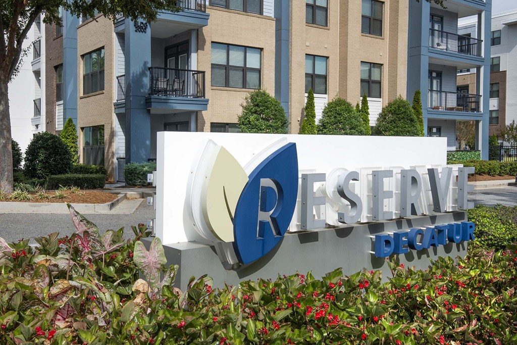 A sign for Reserve Decatur in front of a building.