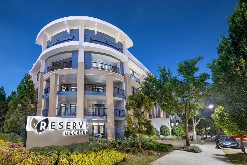 A multi-story building with the sign "RESERVE DECATUR" in front of it.