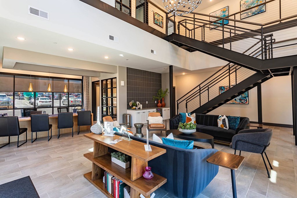 a living room with furniture and a staircase
